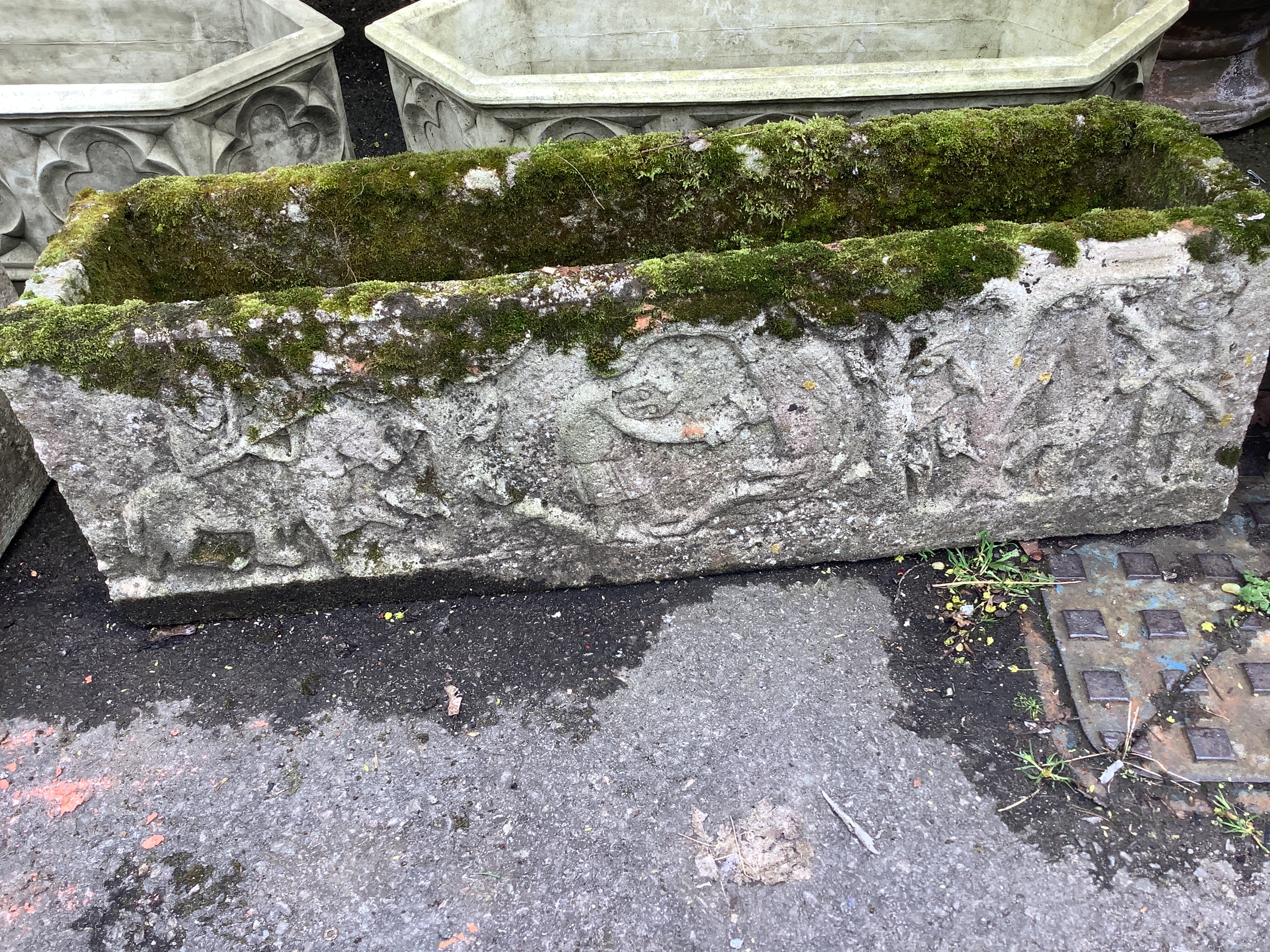 A pair of rectangular reconstituted stone garden trough planters, moulded with classical figures, width 98cm, depth 25cm, height 30cm